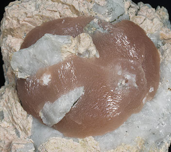 Calcite with Feldspar, Quartz and Pyrite. 